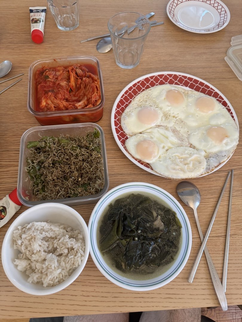 Home breakfast with eggs and seaweed soup